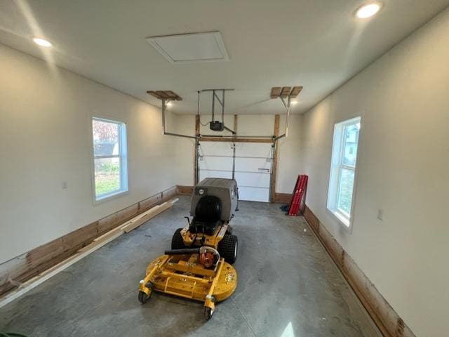 516 Elm St, Redwood Falls, MN 56283 - garage featuring a garage door opener, recessed lighting, and baseboards