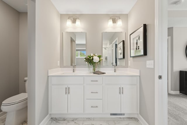 bathroom with vanity and toilet