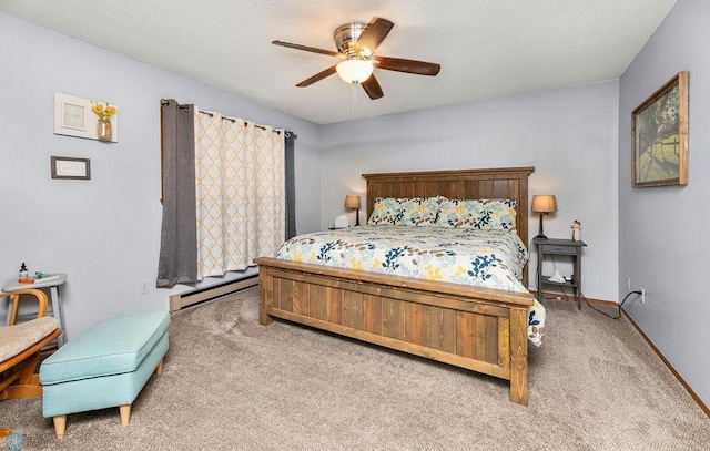 bedroom with ceiling fan, a baseboard radiator, and light carpet