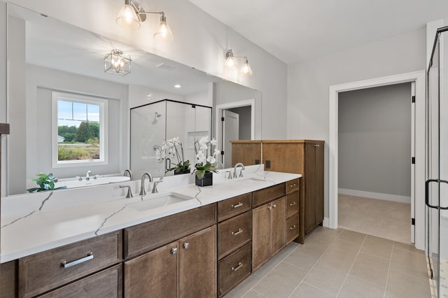 bathroom with vanity, tile patterned floors, and walk in shower