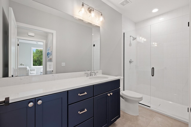 bathroom featuring vanity, tile patterned floors, toilet, and walk in shower