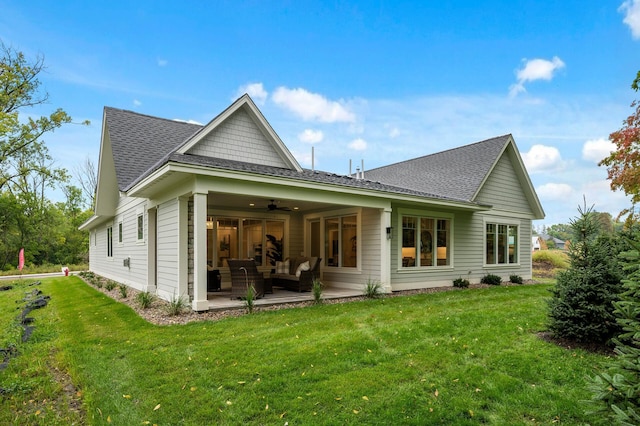 back of house with a patio, an outdoor hangout area, a yard, and ceiling fan