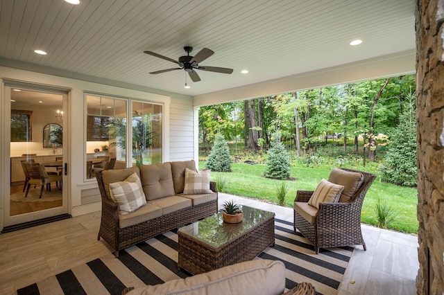 view of patio / terrace with ceiling fan and an outdoor living space