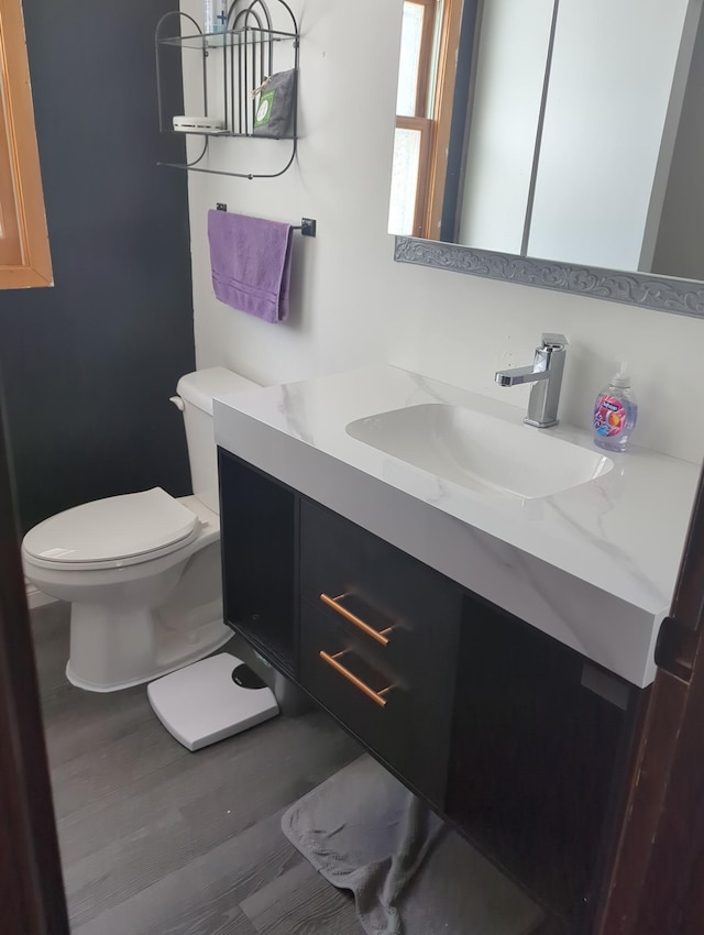 half bath with vanity and toilet