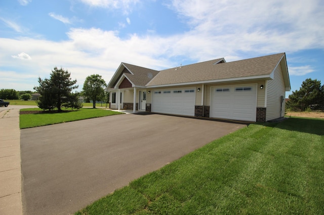 view of front facade with a front lawn and a garage