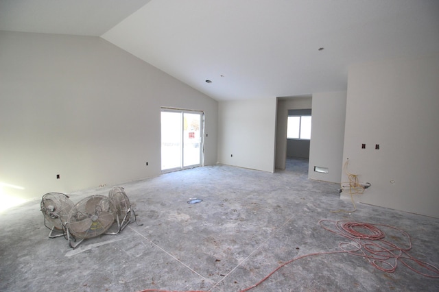 unfurnished room featuring vaulted ceiling