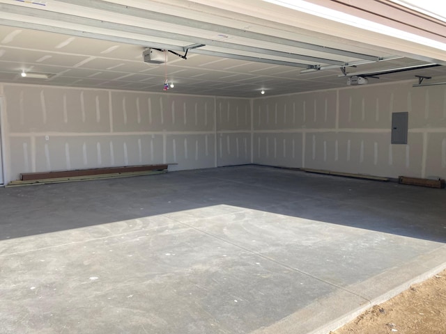 1067 241st Ln NE, East Bethel, MN 55005 - garage featuring a garage door opener and electric panel