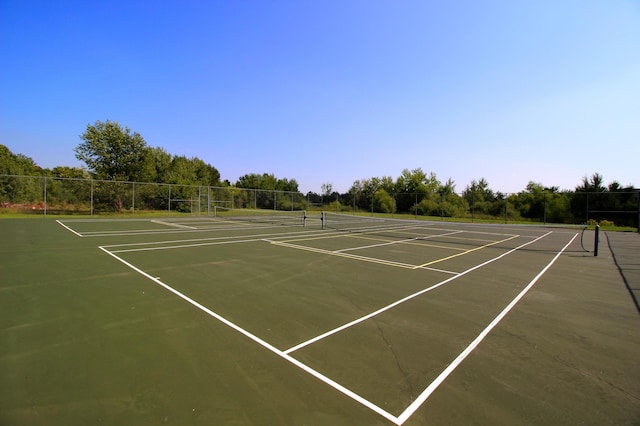 1067 241st Ln NE, East Bethel, MN 55005 - view of tennis court with fence and community basketball court