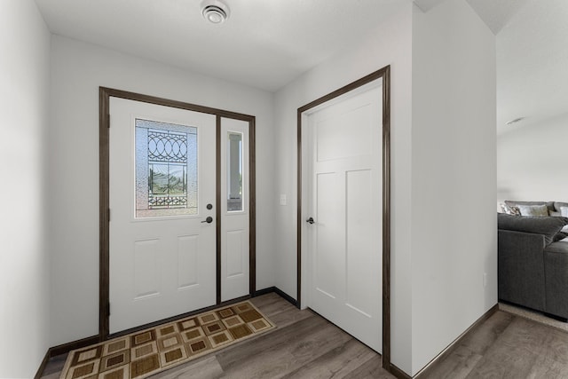 1067 241st Ln NE, East Bethel, MN 55005 - entrance foyer with wood finished floors and baseboards