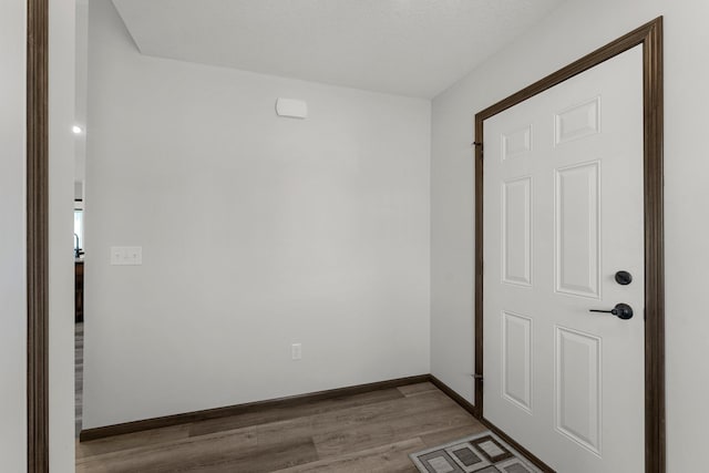 1067 241st Ln NE, East Bethel, MN 55005 - empty room featuring wood finished floors and baseboards