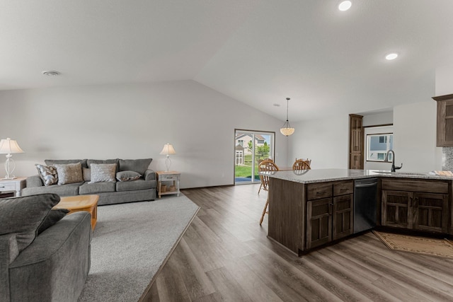 1067 241st Ln NE, East Bethel, MN 55005 - living area featuring wood finished floors, lofted ceiling, and recessed lighting