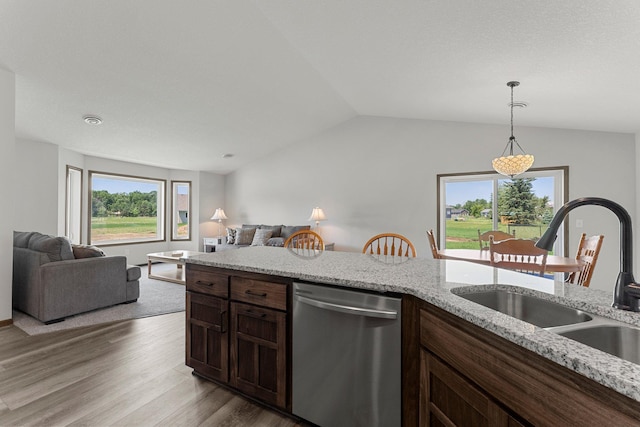 1067 241st Ln NE, East Bethel, MN 55005 - kitchen featuring dishwasher, open floor plan, lofted ceiling, wood finished floors, and decorative light fixtures