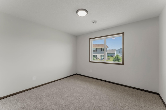 1067 241st Ln NE, East Bethel, MN 55005 - empty room with carpet floors and a smoke detector