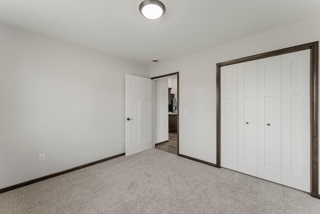 1067 241st Ln NE, East Bethel, MN 55005 - unfurnished bedroom with carpet floors and a closet