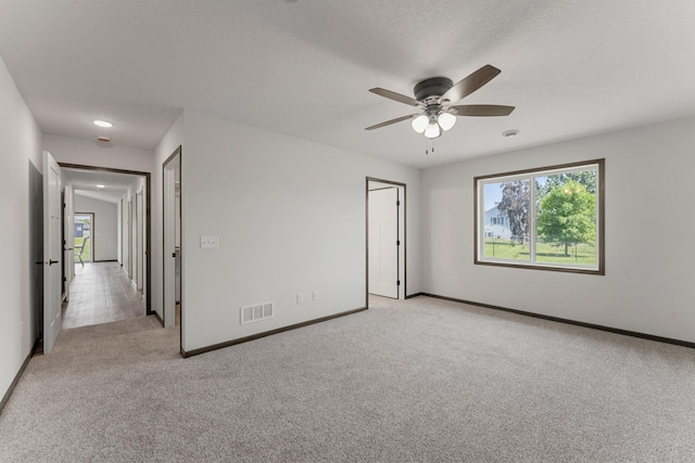 1067 241st Ln NE, East Bethel, MN 55005 - empty room featuring light colored carpet and a ceiling fan