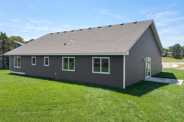 1067 241st Ln NE, East Bethel, MN 55005 - rear view of property featuring roof with shingles and a lawn