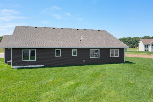1067 241st Ln NE, East Bethel, MN 55005 - rear view of house featuring a shingled roof and a yard
