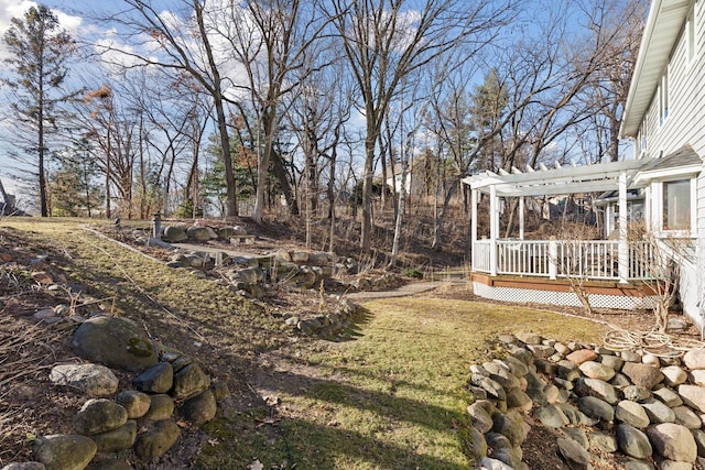 view of yard with a pergola and a wooden deck