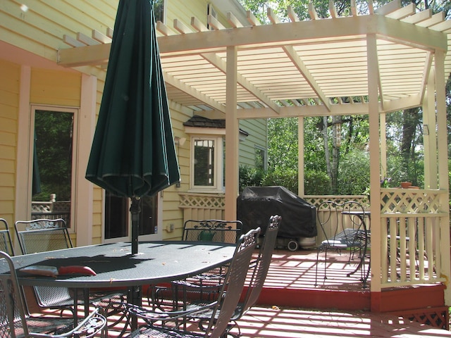 deck featuring a pergola and grilling area