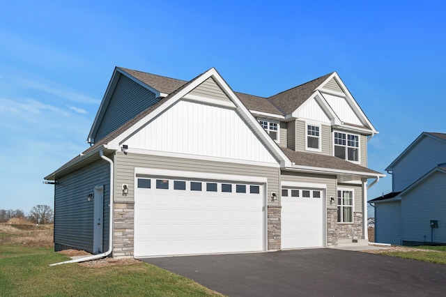 craftsman-style home with a garage