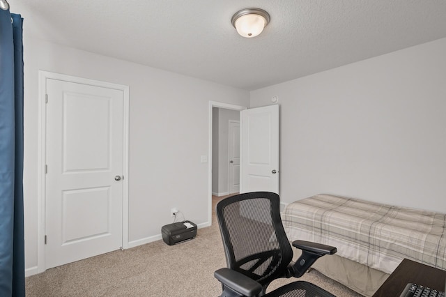 office space with carpet floors and a textured ceiling