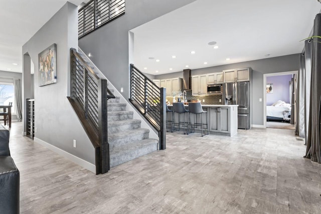 staircase featuring hardwood / wood-style flooring