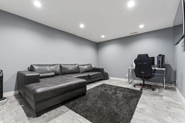 living room with light hardwood / wood-style floors