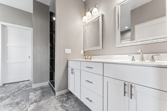 bathroom with vanity and a shower