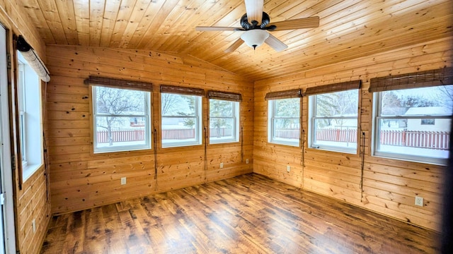 unfurnished sunroom featuring lofted ceiling, ceiling fan, and wooden ceiling