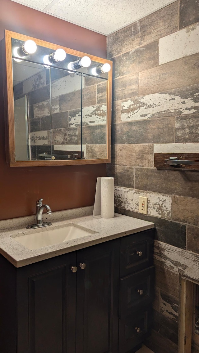 bathroom featuring a textured ceiling and vanity