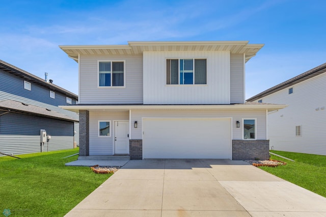 view of front of home featuring a garage and a front lawn