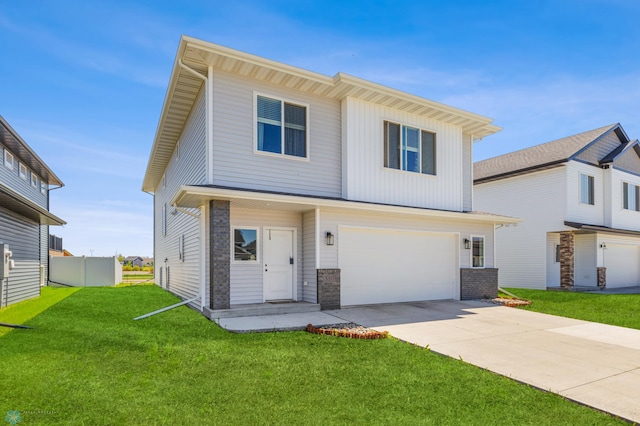 view of front of house with a front lawn and a garage