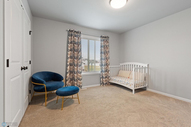 carpeted bedroom with a crib