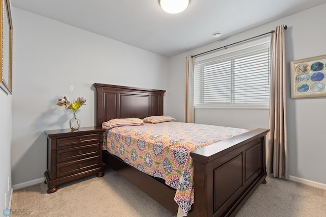 bedroom with light colored carpet