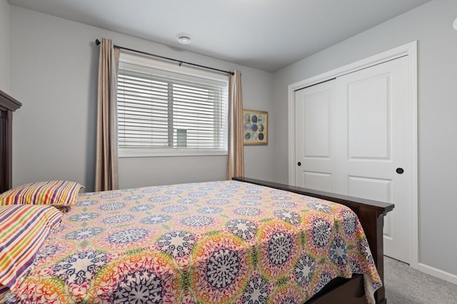 bedroom with carpet floors and a closet