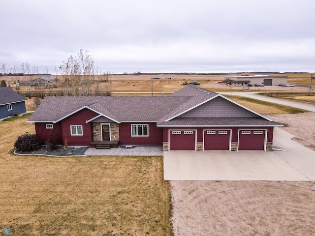 view of front facade featuring a garage and a front lawn