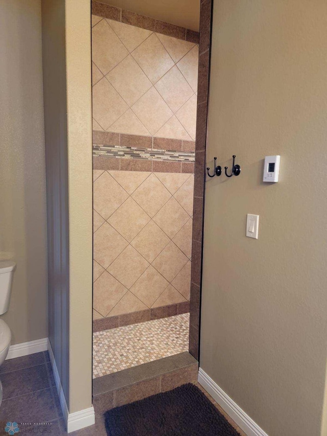 bathroom featuring tile patterned flooring and toilet