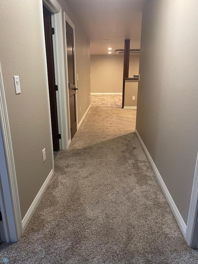 hallway featuring carpet