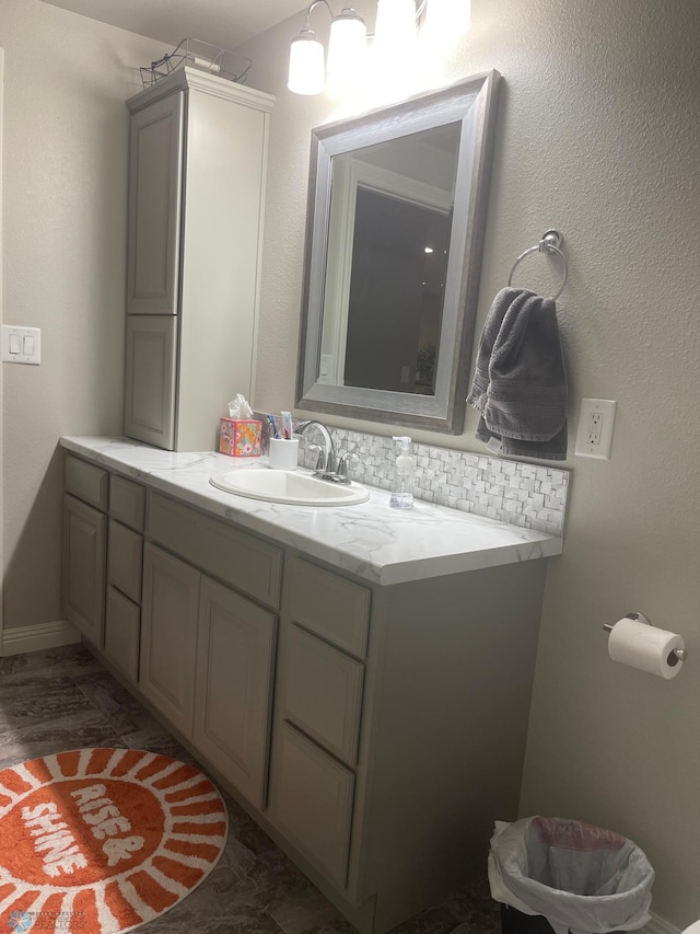 bathroom featuring decorative backsplash and vanity