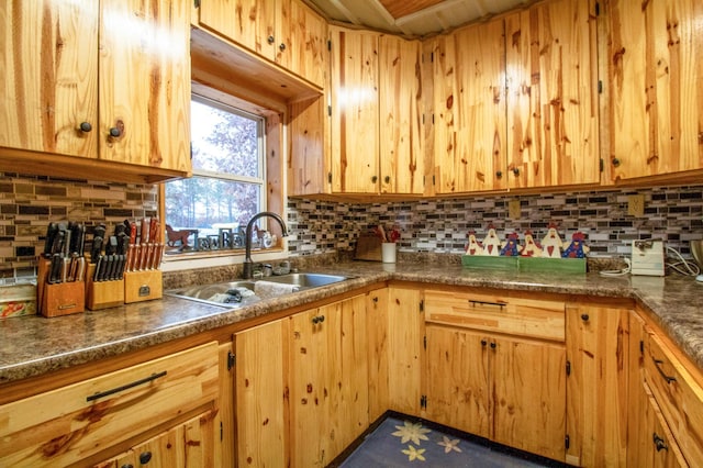 kitchen featuring decorative backsplash and sink