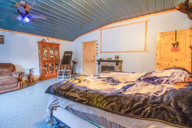 carpeted bedroom with a fireplace, ceiling fan, and lofted ceiling