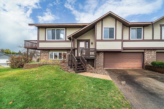 view of front facade featuring a front yard and a garage