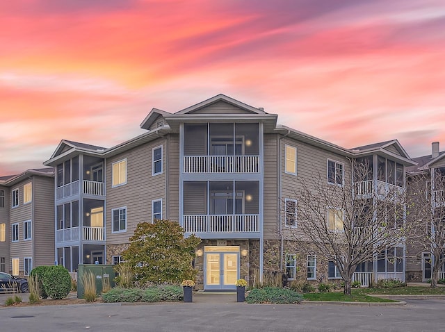 view of outdoor building at dusk