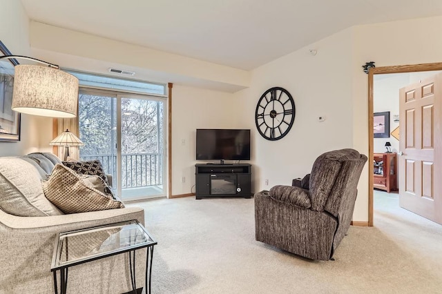 living room with carpet and vaulted ceiling