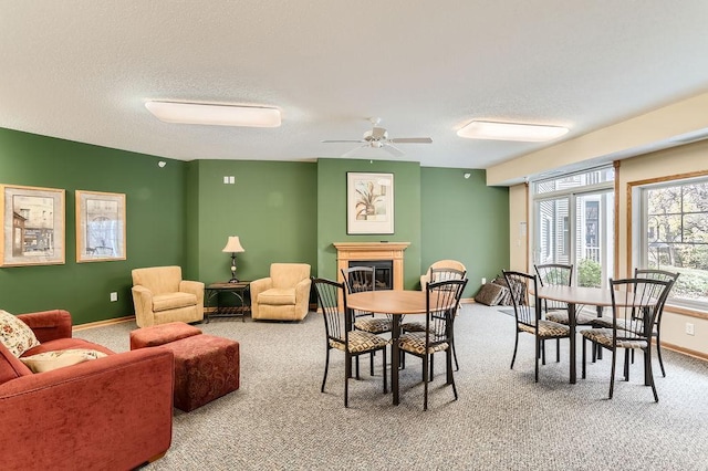 dining area featuring carpet flooring and ceiling fan