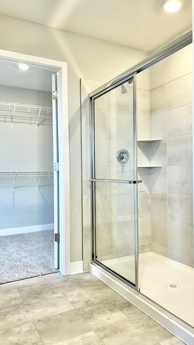 bathroom featuring an enclosed shower