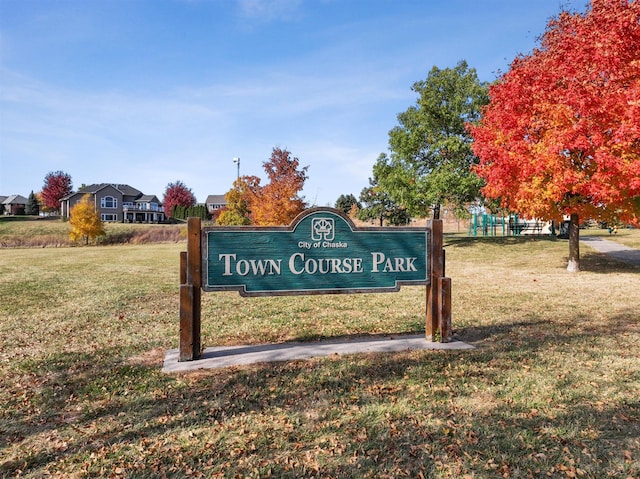 view of property's community with a lawn