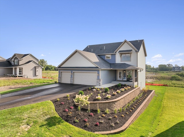 view of front of house with a front lawn and a garage