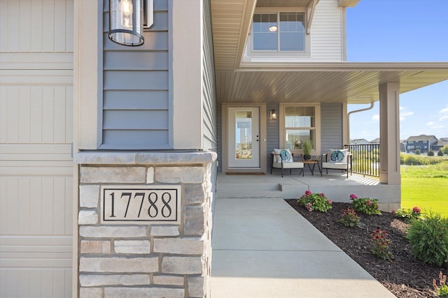 property entrance with covered porch