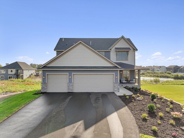 craftsman-style house with a front lawn